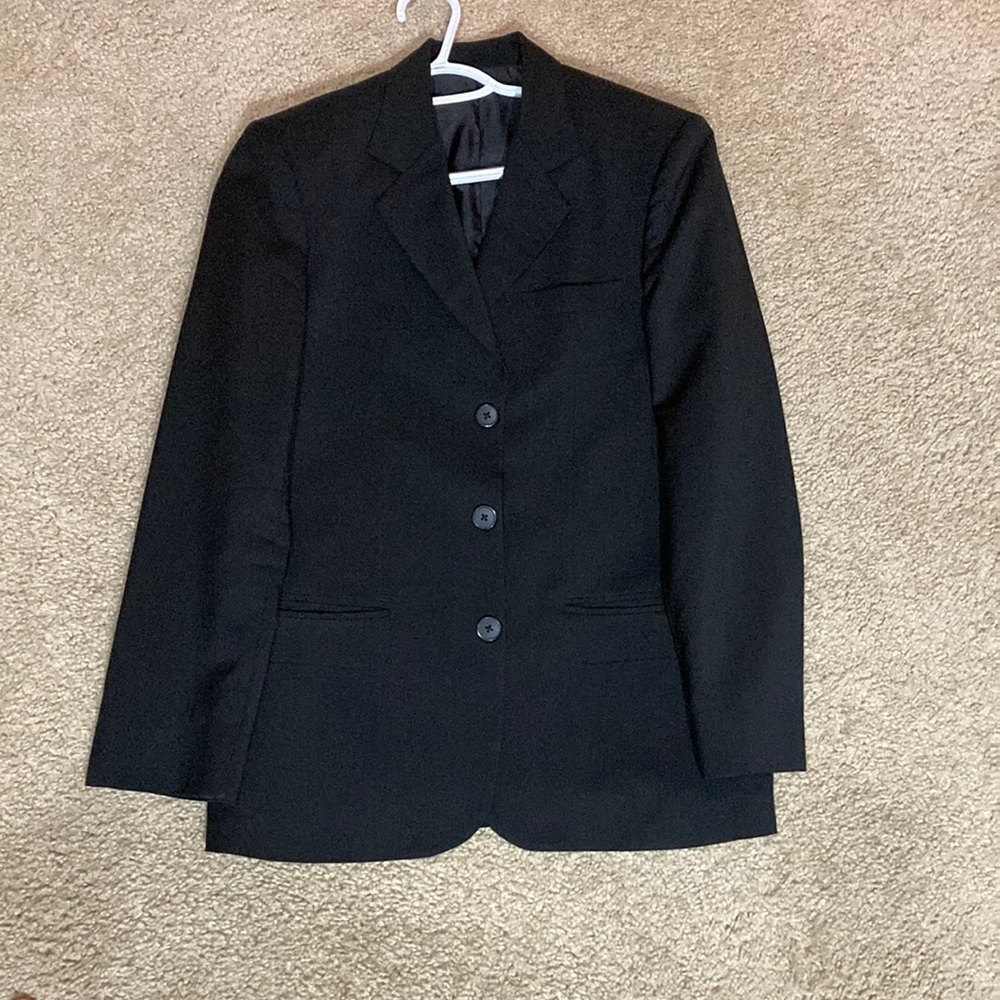 Black wool suit, jacket and pants. Excellent condition. Used couple of times.